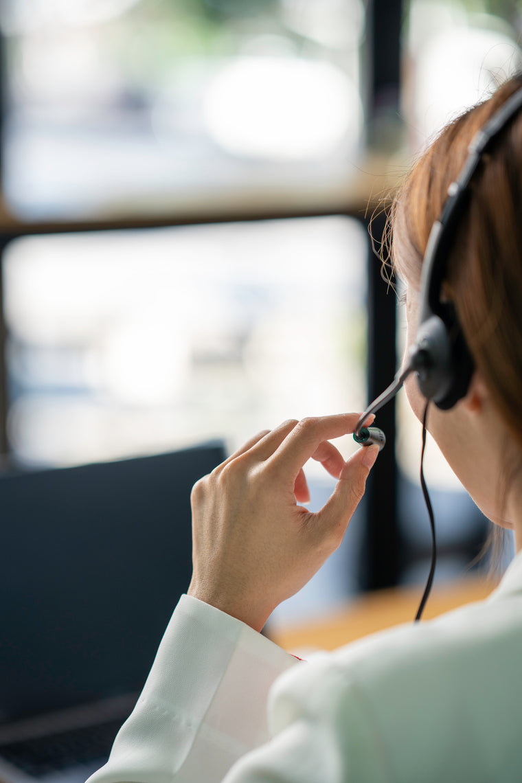 A person using a headset with a microphone attached