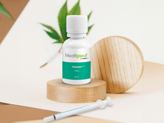 A bottle of MedReleaf Vespera cannabis oil with a syringe 